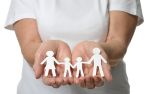 Family law mediation attorney holding paper cut out of a family.